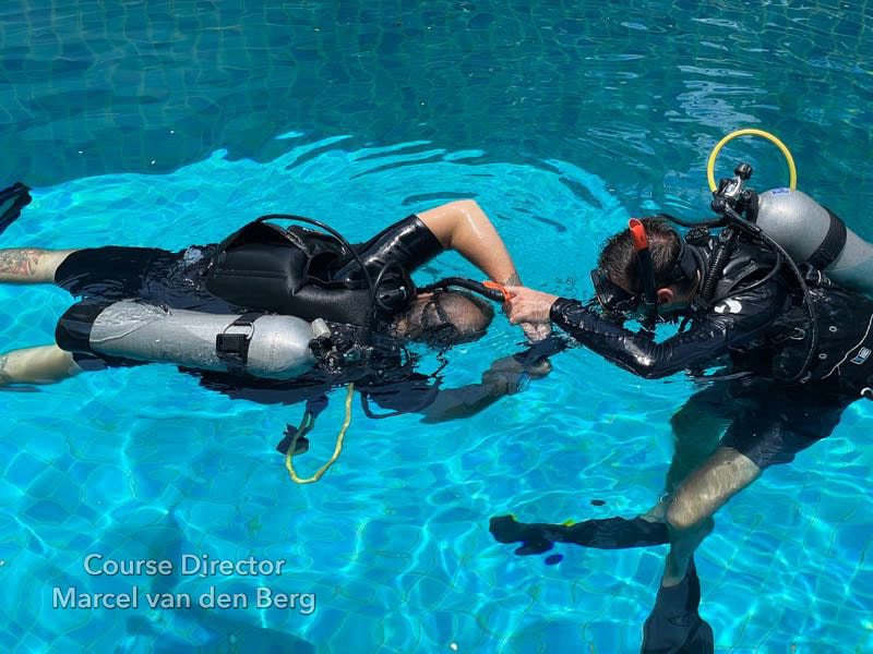 Rescuer turns the victim to a face-up position by gripping hands or wrists and rolling PADI Rescue Exercise 7
