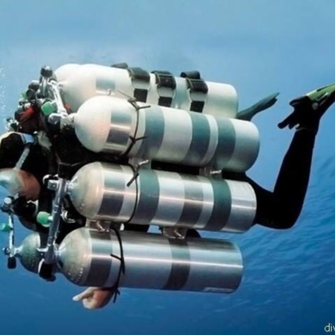 Many scuba cylinder diver