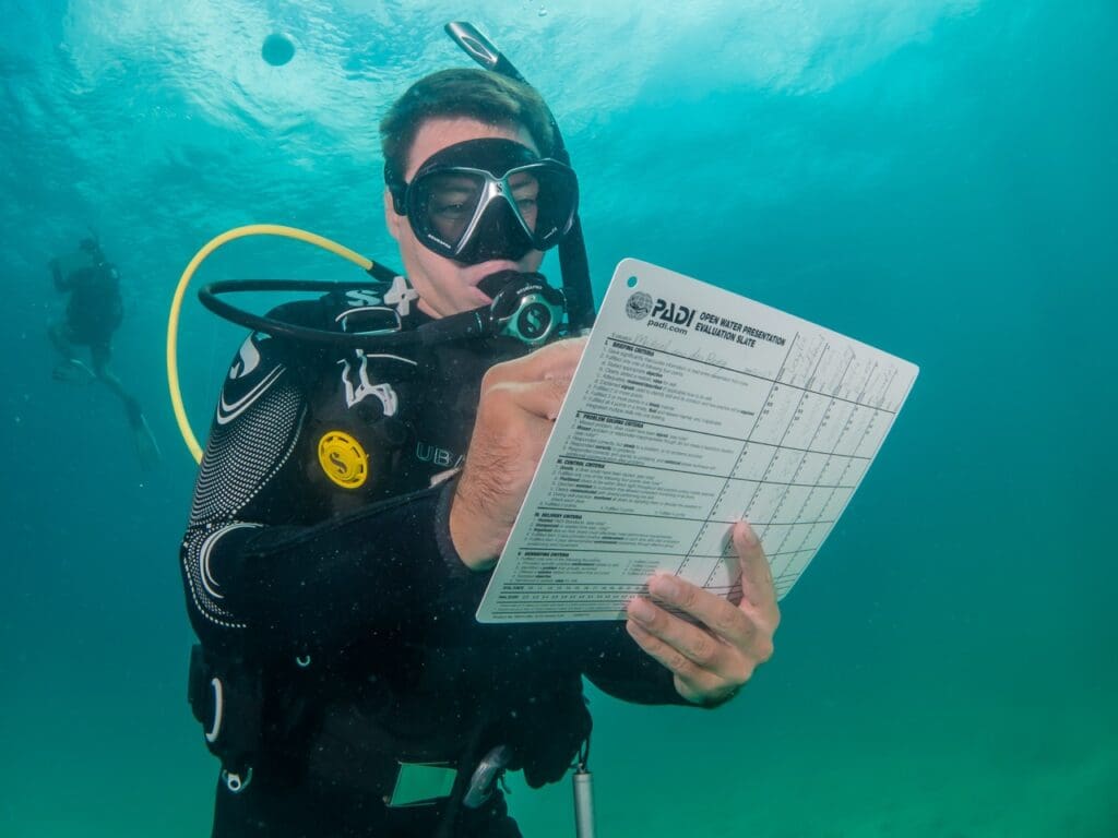 Marcel van den Berg evaluating PADI Instructor candidates during underwater training